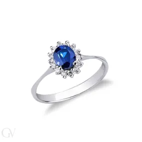 Anello contorno in oro bianco 18k con diamanti e Zaffiro blu ovale
